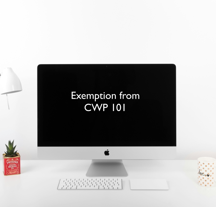 computer on desk with screen that reads "Exemption from CWP 101"