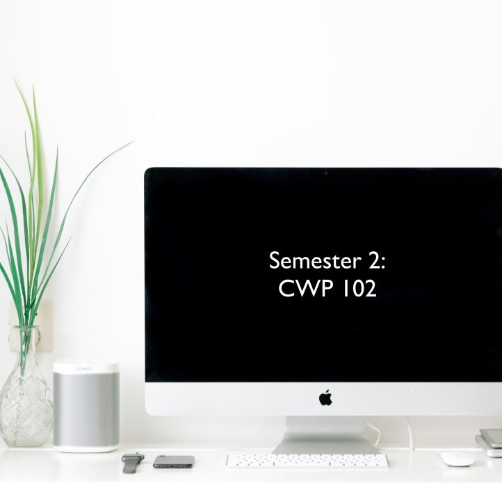 computer on desk with screen that reads "Semester 2: CWP 102"